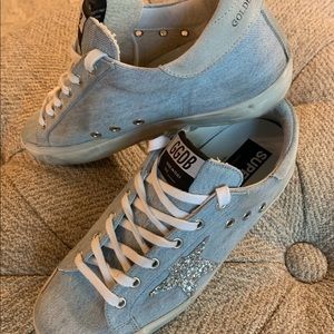 Navy and silver Golden Goose Brand shoes.